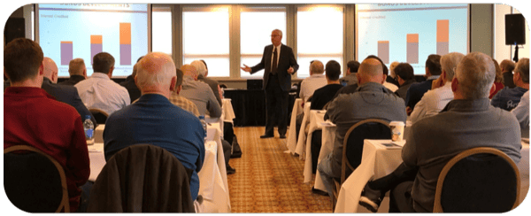 Marty speaking at conference.